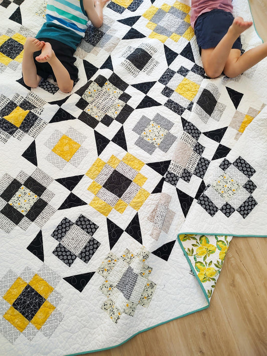 Black and yellow twin size patchwork quilt